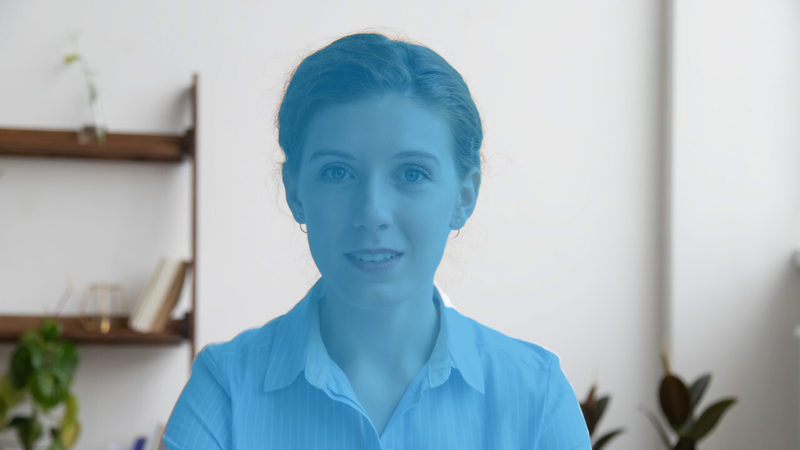 The part of the image that contains the person's body is highlighted in blue, while the room in the background is unchanged.