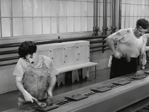 GIF from "Tempos Modernos" movie. Charles Chaplin tightening screws quickly.
